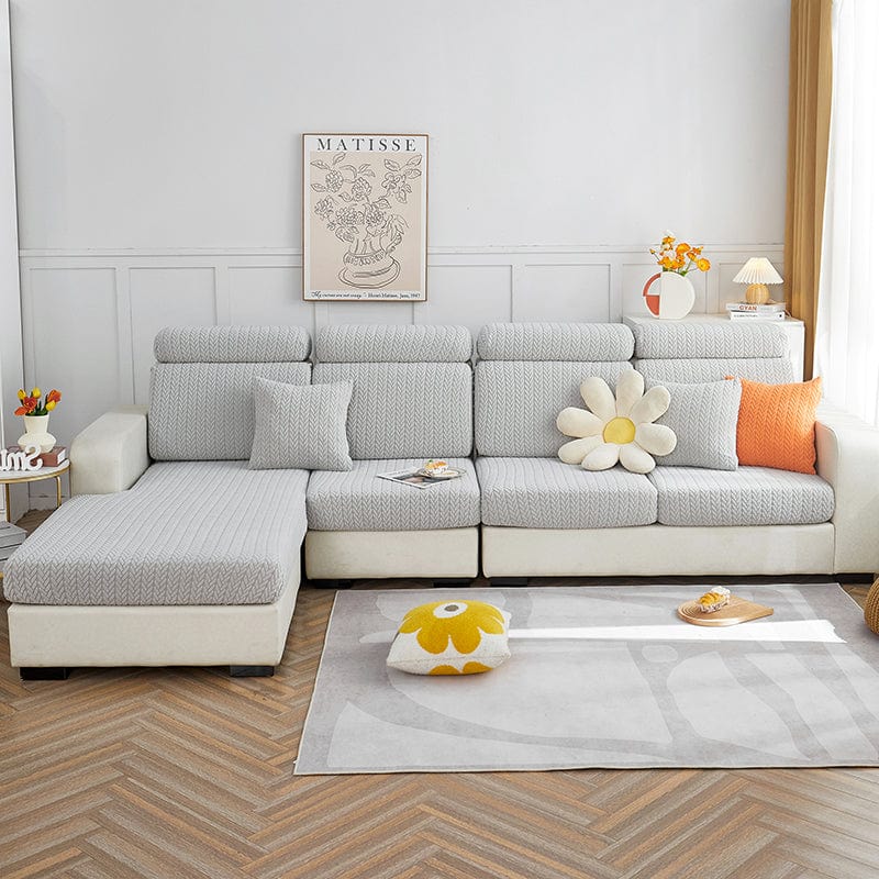 Housse de coussin de canapé polaire, Gris clair épis, posée sur les coussins d'assise et de dossier d'un canapé