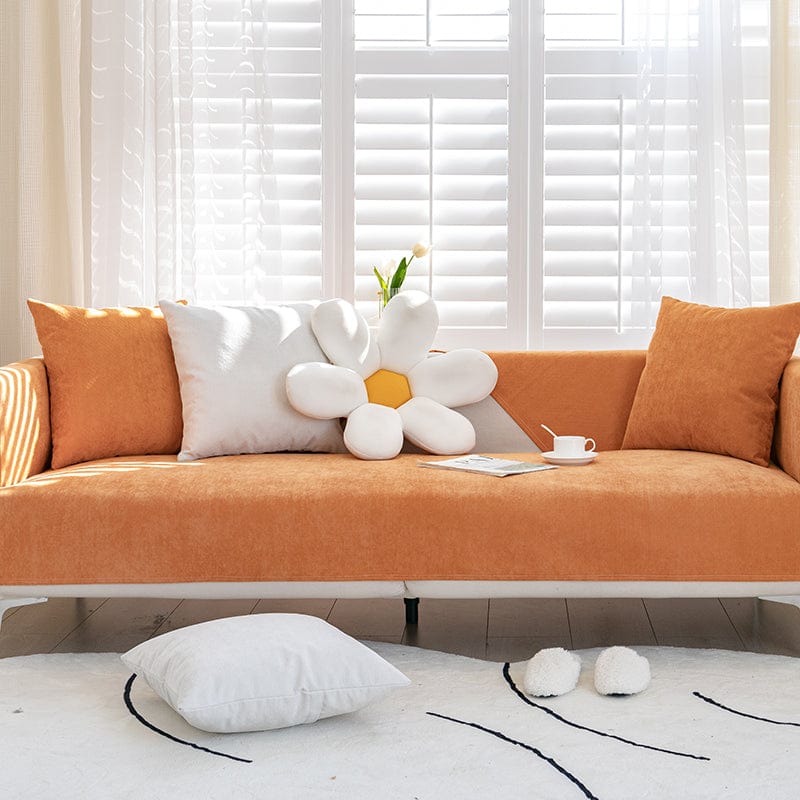 Housse de canapé EasyCover ImperFlex, Orange velouté, posée sur un canapé