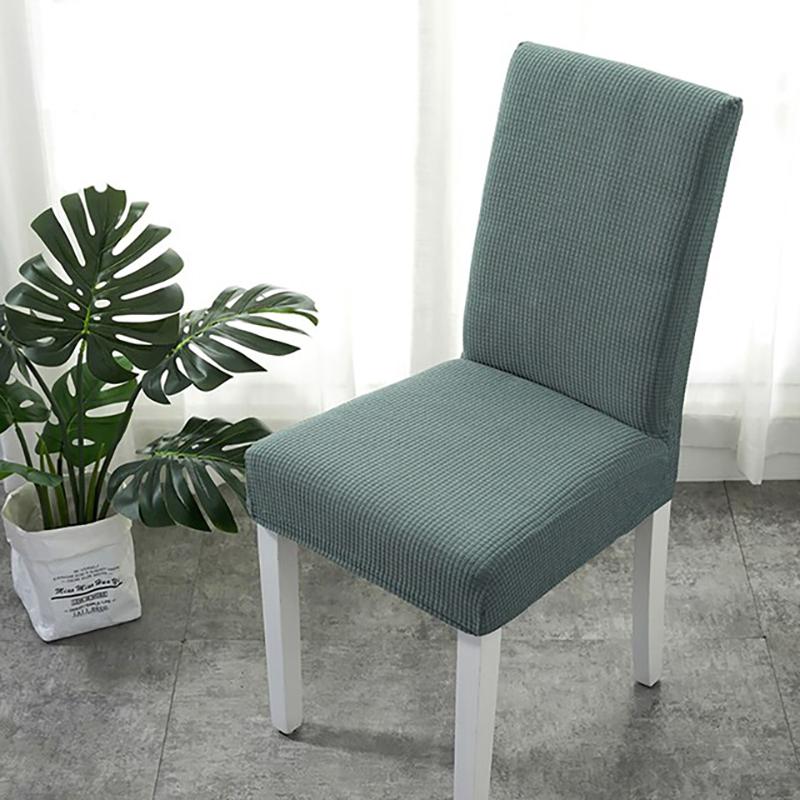 Housse de chaise déperlante, Vert eucalyptus, posée sur une chaise