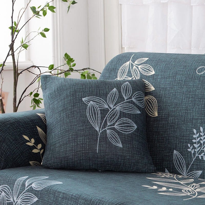 Housses de coussin déperlantes 45×45, lot de 2, Bleu ardoise feuilles blanches, posée sur un canapé