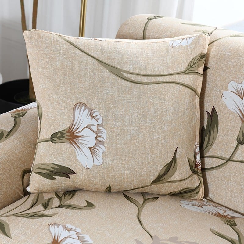 Housses de coussin déperlantes 45×45, lot de 2, Écru fleurs blanches, posée sur un canapé