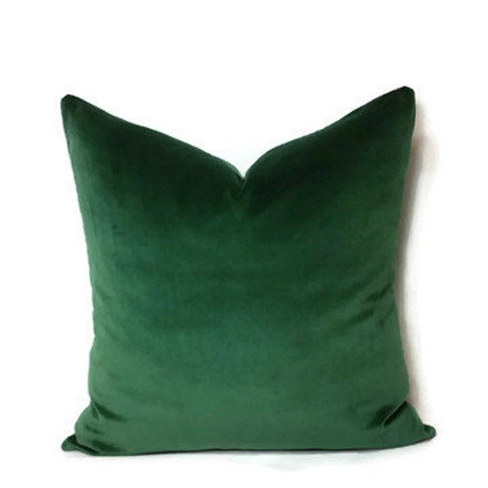 Housses de coussin extensibles 45×45, lot de 2, Vert, posée sur un canapé