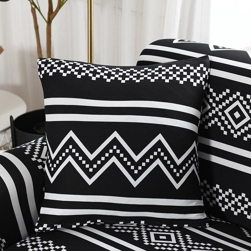 Housses de coussin déperlantes 45×45, lot de 2, Noir zigzags blancs, posée sur un canapé