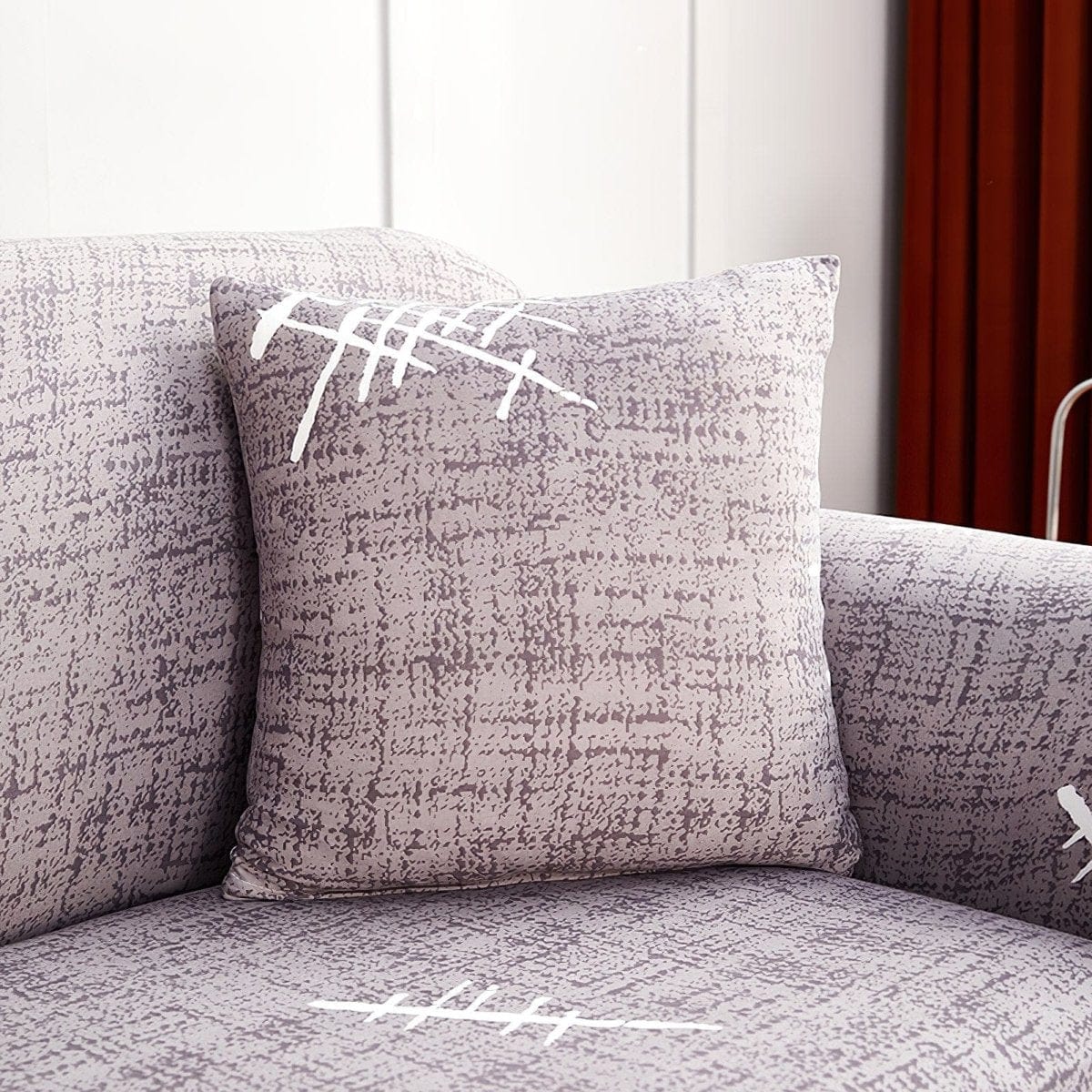 Housses de coussin extensibles 45×45, lot de 2, Gris croisillons, posée sur un canapé