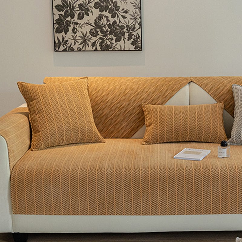 Housse de coussin EasyCover herringbone 45×45, à l'unité, Orange arêtes, posée sur un canapé