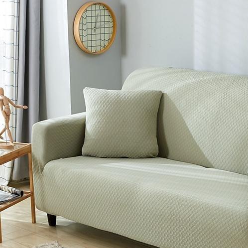 Housse de coussin déperlante 45×45, à l'unité, Vert sauge, posée sur un canapé