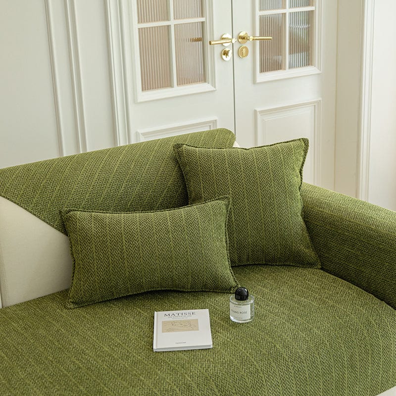 Housse de coussin EasyCover herringbone 45×45, à l'unité, Vert arêtes, posée sur un canapé