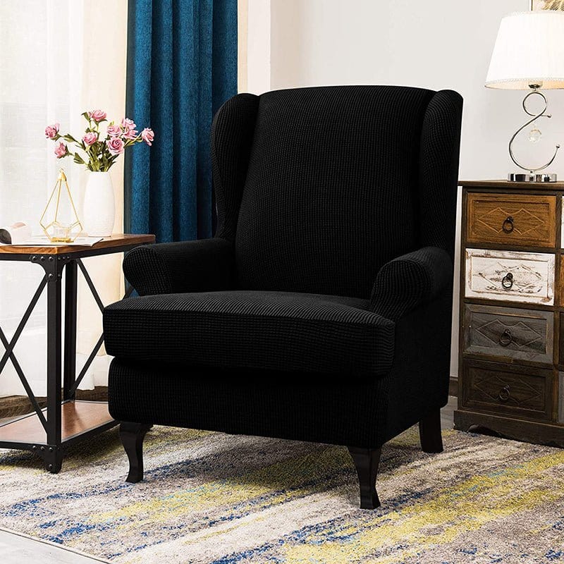 Housse de fauteuil à oreilles déperlante, Noir, posée sur un fauteuil à oreilles