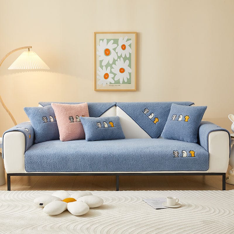Housse de canapé EasyCover sherpa bouclé, Bleu moutonné, posée sur un canapé