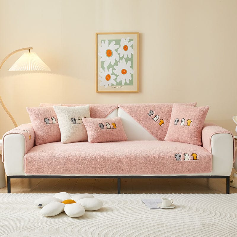 Housse de canapé EasyCover sherpa bouclé, Rose moutonné, posée sur un canapé