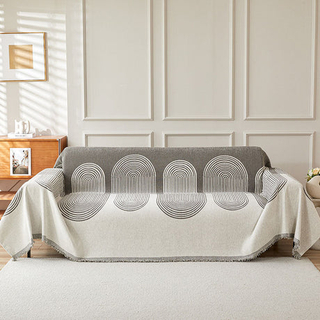 Jeté de canapé tissé Gris arches, posé et drapé sur un canapé
