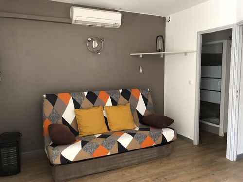 Clic-clac habillé d'une housse extensible Patchwork orange et marine, photo envoyée par Katia M. avec son avis