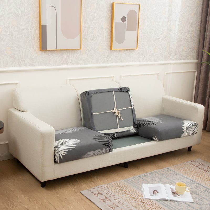 Housse de coussin de canapé extensible, Gris palmes, posée sur les coussins d'assise et de dossier d'un canapé — vue 2