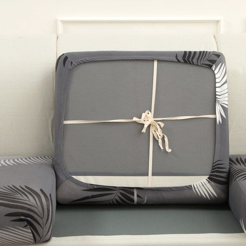Housse de coussin de canapé extensible, Gris palmes, posée sur les coussins d'assise et de dossier d'un canapé — vue 3