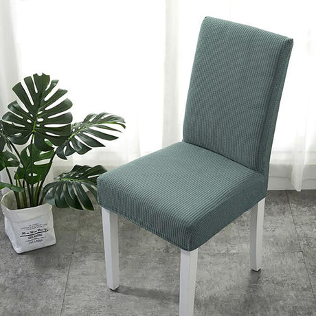 Housse de chaise déperlante, Vert eucalyptus, posée sur une chaise