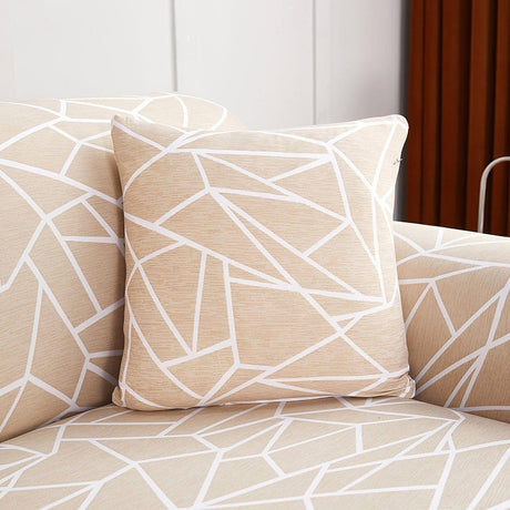 Housses de coussin extensibles 45×45, lot de 2, Beige graphique, posée sur un canapé