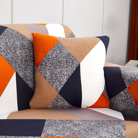 Housses de coussin extensibles 45×45, lot de 2, Patchwork orange et marine, posée sur un canapé