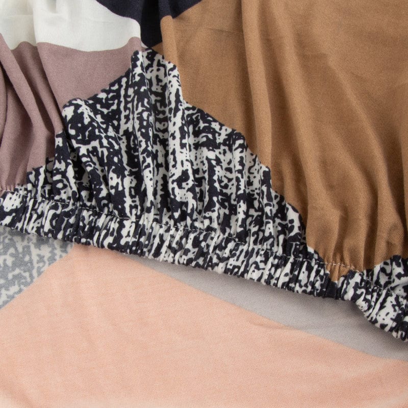 Housse de coussin de canapé extensible, Patchwork orange et marine, posée sur les coussins d'assise et de dossier d'un canapé — vue 4